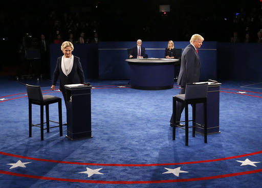 Democratic presidential nominee Hillary Clinton, left, and Republican presidential nominee Donald Trump arrive before the second presidential debate at Washington University in St. Louis, Sunday, Oct. 9, 2016. (Jim Bourg/Pool via AP)