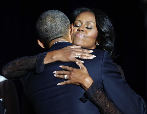 First lady Michelle Obama hugs President Barack Obama after his farewell address at McCormick Place in Chicago, Tuesday, Jan. 10, 2017. (AP Photo/Pablo Martinez Monsivais)