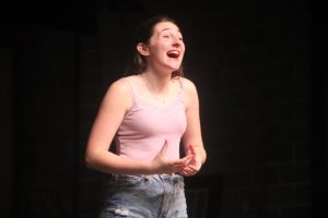 Senior Dylan Dean singing on stage at a practice for the Fall 2023 Musical "Anastasia" in the Performing Arts Center