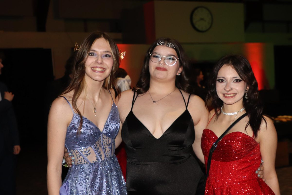 A Trio together. Seniors Autumn Hubbard, Mila Hawkins and Junior Marz Marchant are hanging out together at prom. Prom this year is said to be different then last years. “Everybody showed up last year. it was like kind of barren, but everybody seemed to have fun this year. It was it was it was cool getting to see everybody, and like see everybody,” Marchant said.