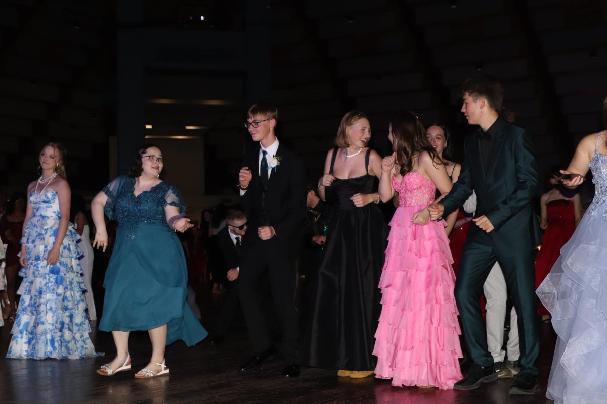 Dancing for Love. Allison Findlay and Graham Elbert dancing during the line dance. This is Findlay and Elbert ‘s first prom together as a couple. “I love to dance, and Graham… enjoys being with me at dances. It's kind of funny, because I go all into it, and he's like trying his best. It's really sweet. I feel kind of bad sometimes because I make him join in on the line dances, and he does not entirely want to, but like he will, because he's cool, like that,” Findlay said. 