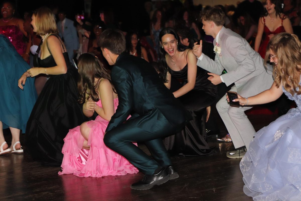 Getting down on the dance floor. Senior Aurora Hilbert dancing to music at prom. Hilbert is an exchange student from germany. “I went to prom with 2 friends of mine, Naomi Butler and Noellie Pot,” Hilbert said. 