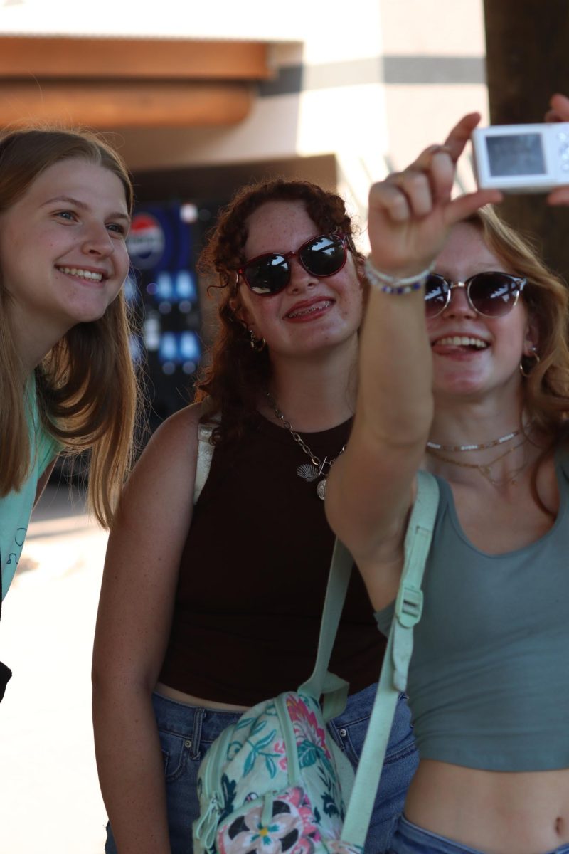 Juniors. Ayslei Morris-Jones, Natalie Newkirk, and Maddy Davis pose for a photo on a digtal camera at the IB Environmental systems and Societies field trip.    