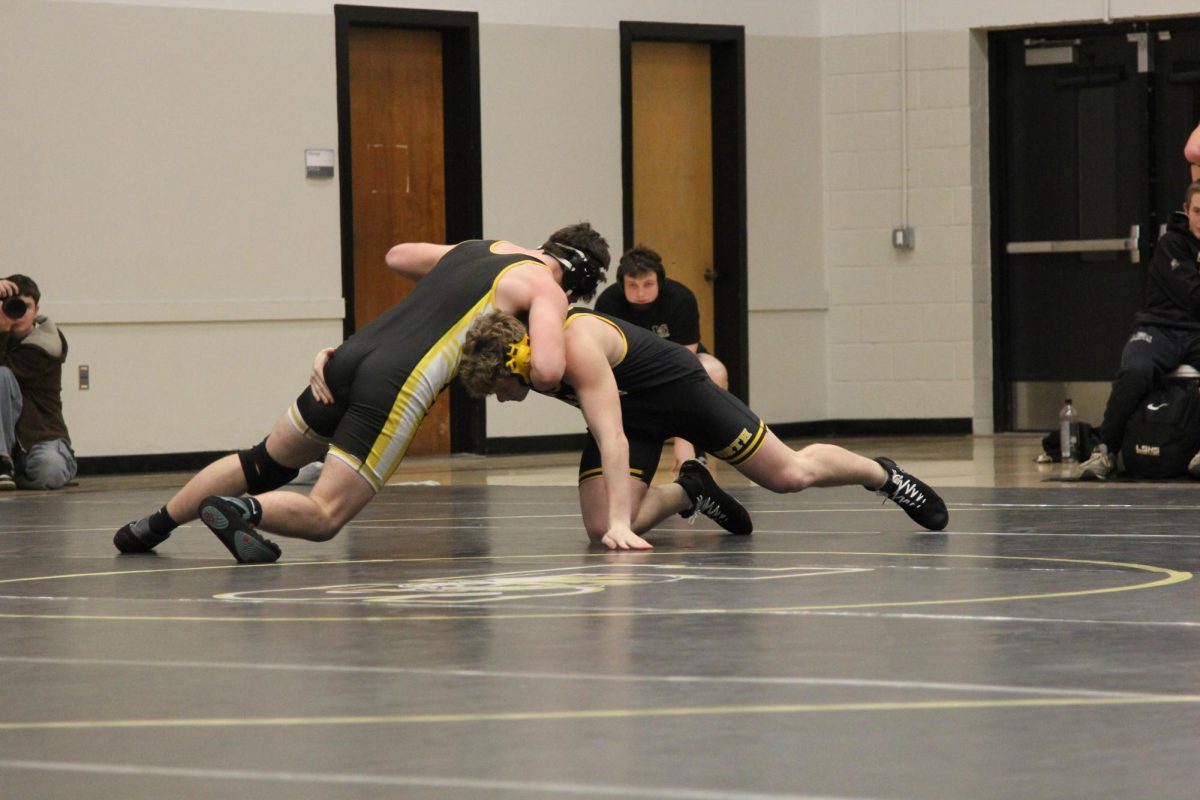 Students wrestle. Photo by Josh Muckenthaler.