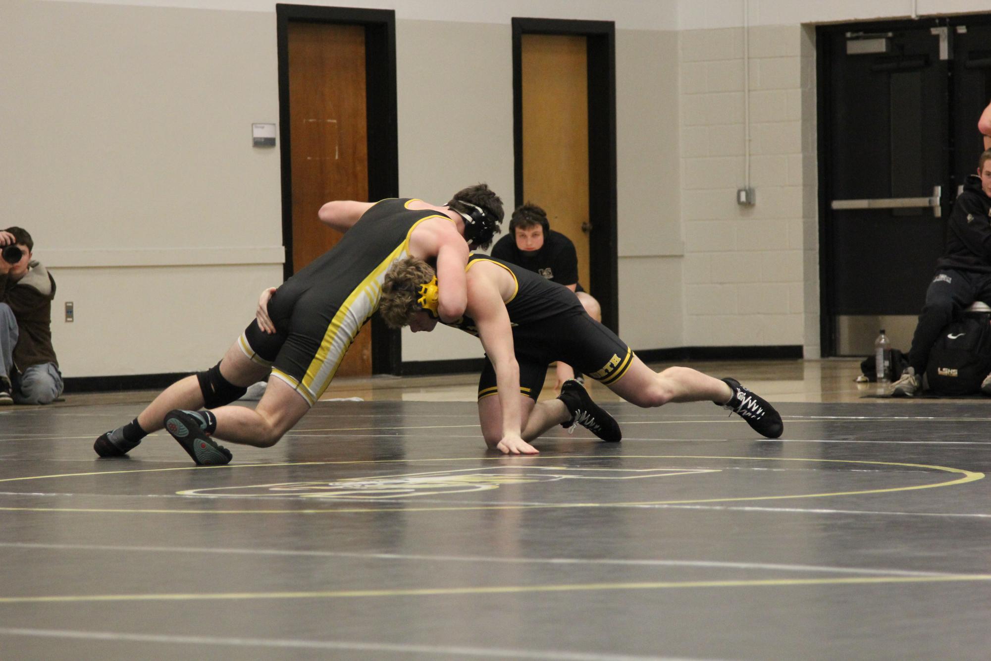 Students wrestle. Photo by Josh Muckenthaler.