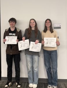 Coy Reuhter, Addison Williams, and Giada Bonati won awards from the 2026 JEMKC contest. Photo by Meredith Boehm.